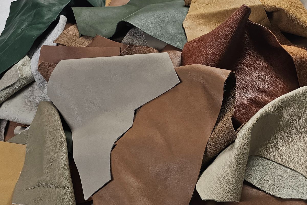 mixed leather scraps and offcuts used for leathercraft projects and handmade goods