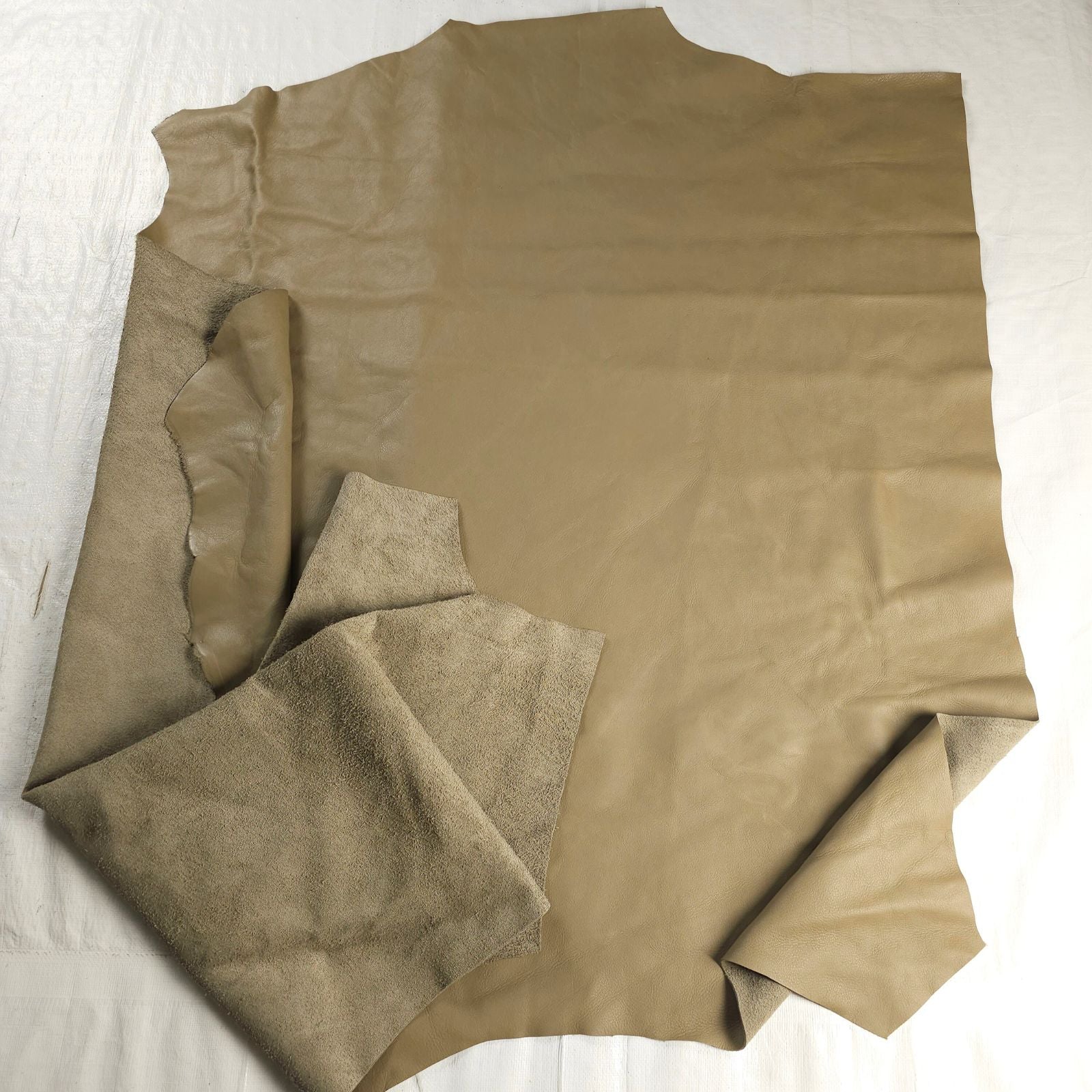 Large chrome tanned upholstery leather cuts, khaki green pieces with suede underside