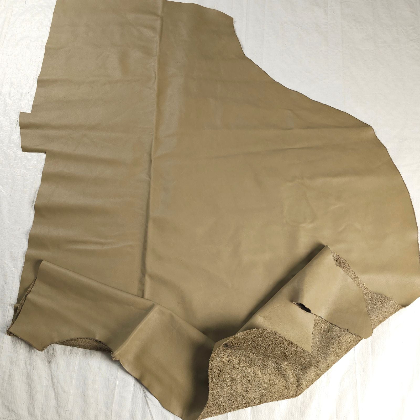 Large chrome tanned upholstery leather piece with folded edge