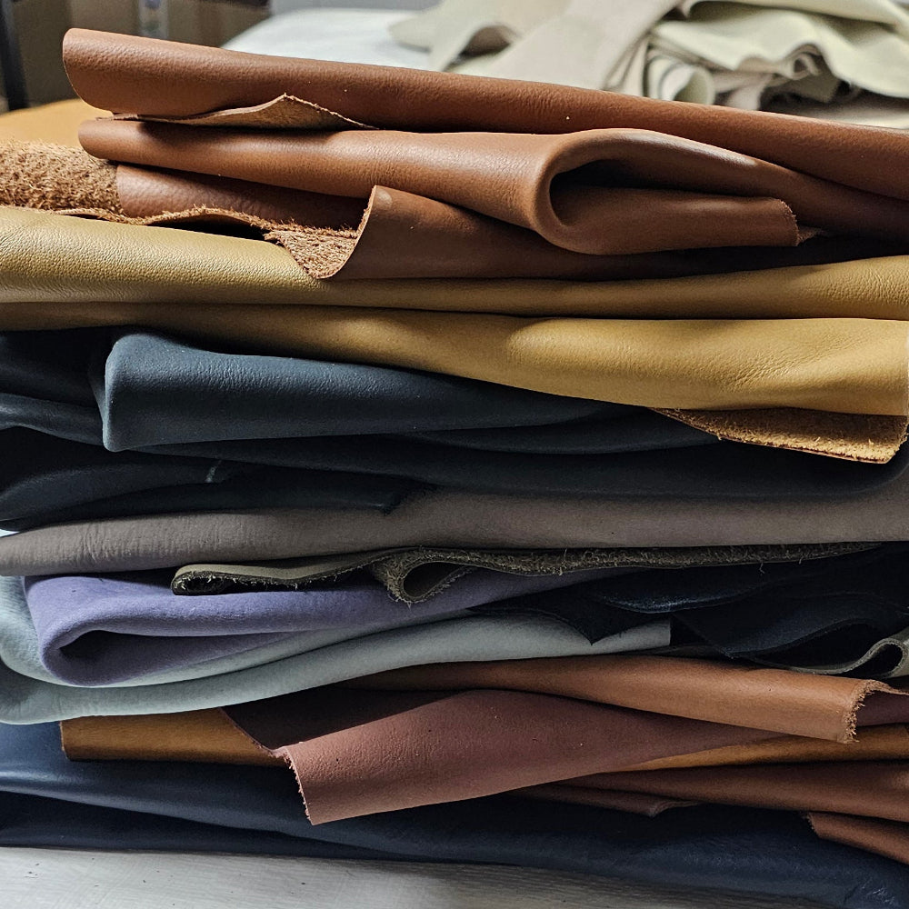 Stacked medium cowhide leather pieces in assorted colours