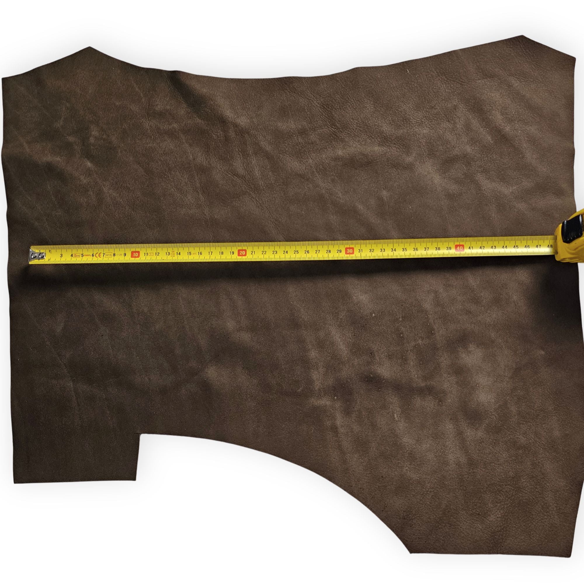 Brown nubuck leather piece shown with measuring tape
