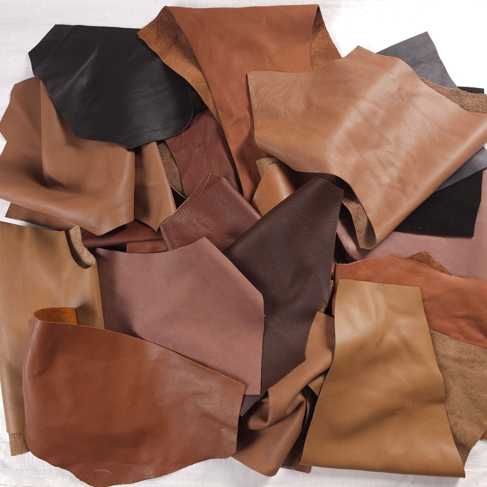 Assorted brown leather scraps in caramel, tan and chocolate tones