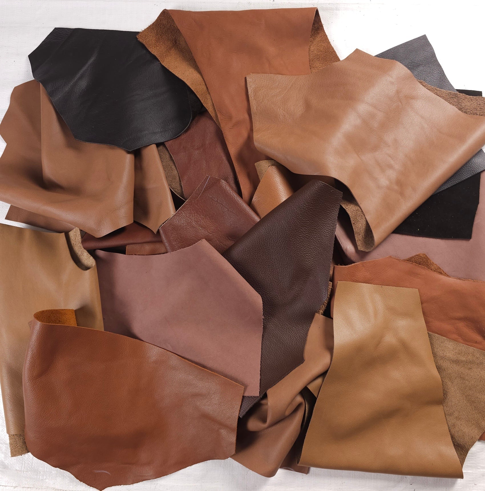 Assorted brown leather scraps in caramel, tan and chocolate tones