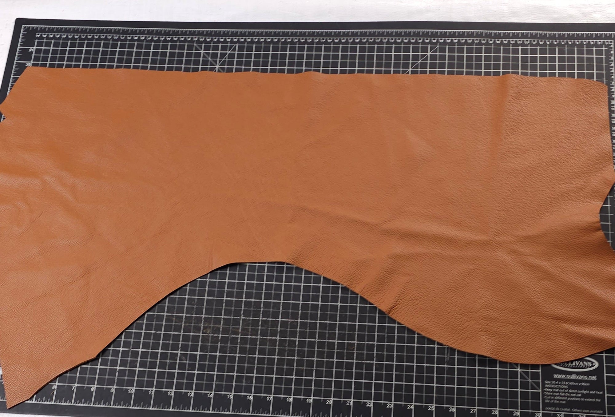 Caramel, tan and dark brown cowhide leather pieces for leathercraft