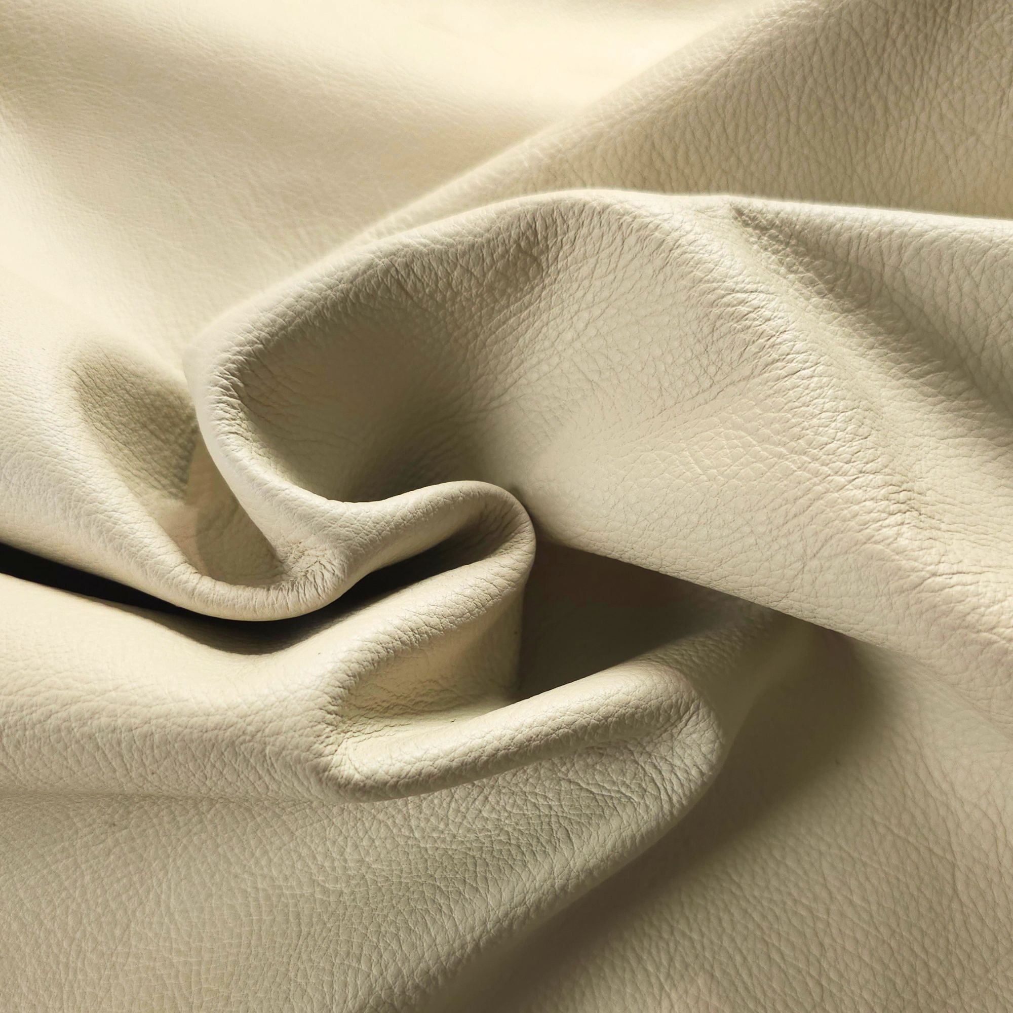 Close-up of cream upholstery leather grain and texture