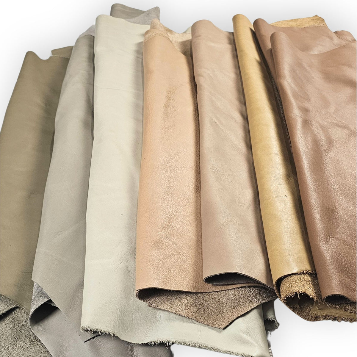 Rolled large leather pieces in cream, beige and light brown