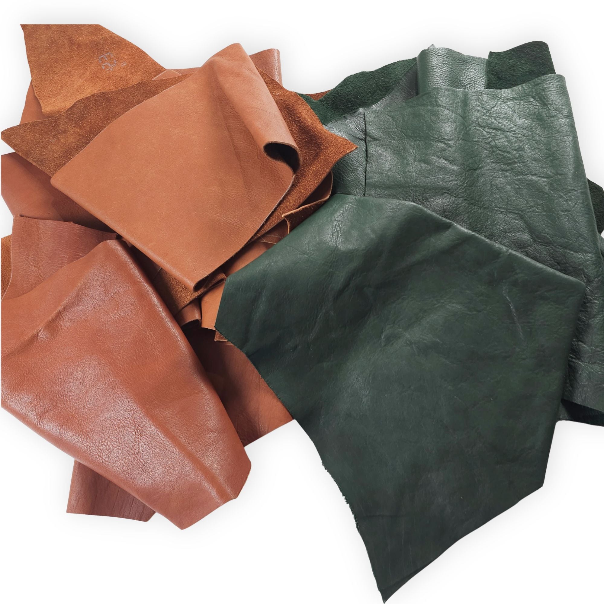 Mixed forest green and tan vegetable-tanned cowhide pieces in 1–3 hand sizes