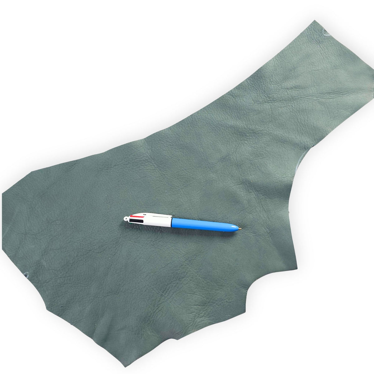 Dark green cowhide leather scrap showing natural grain and shape