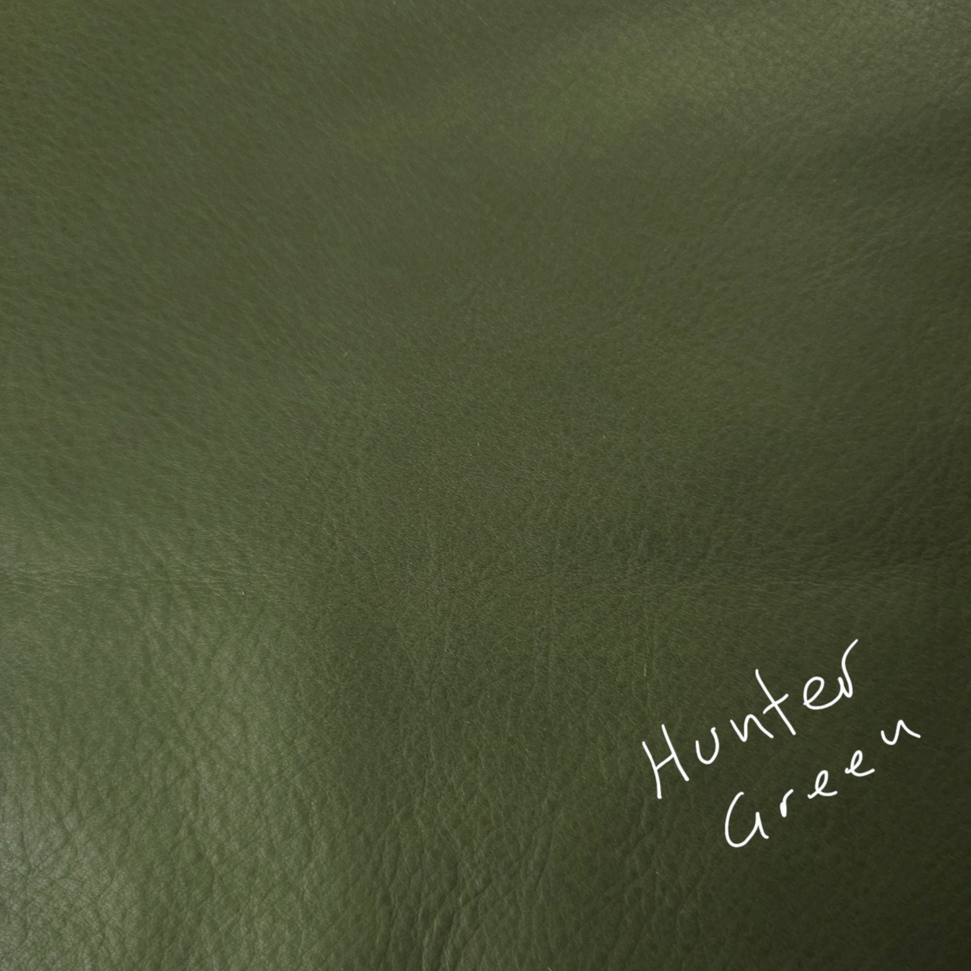 Hunter green cowhide leather piece in a deep solid colour