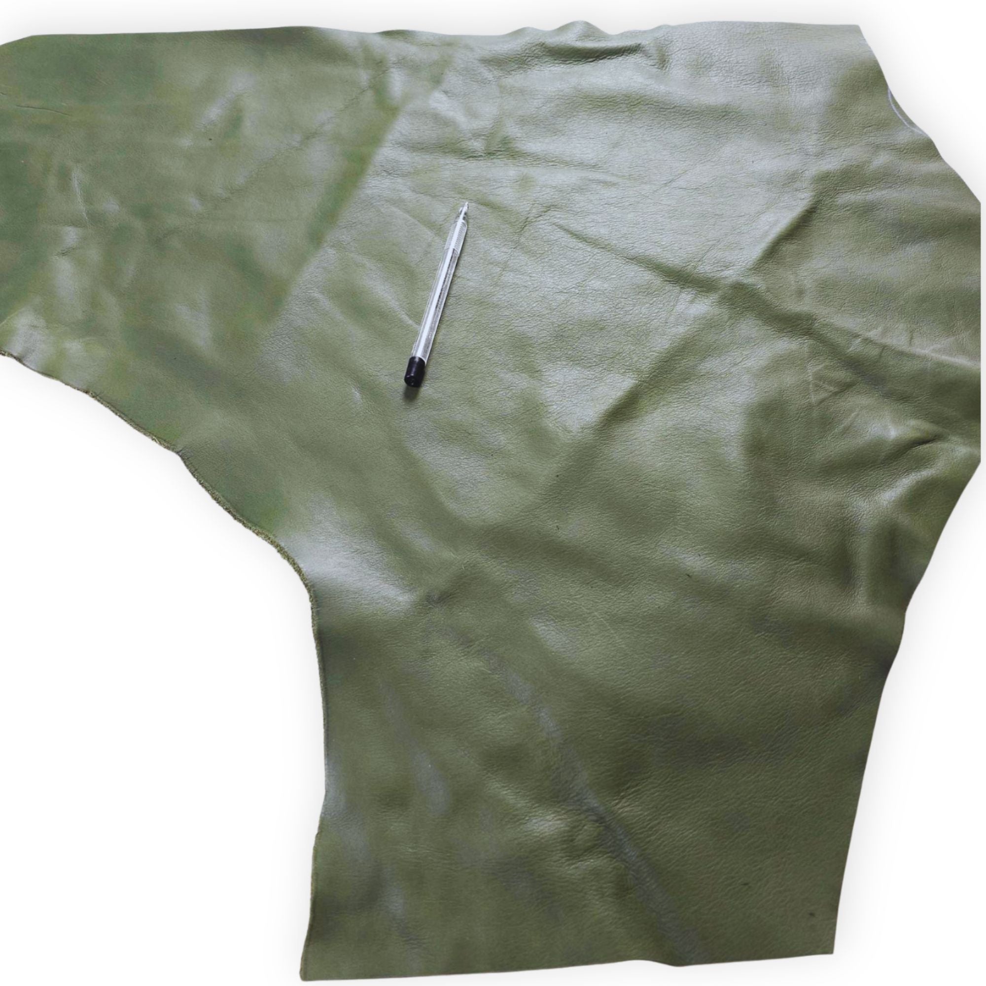 Large assorted green cowhide offcuts showing natural grain and texture