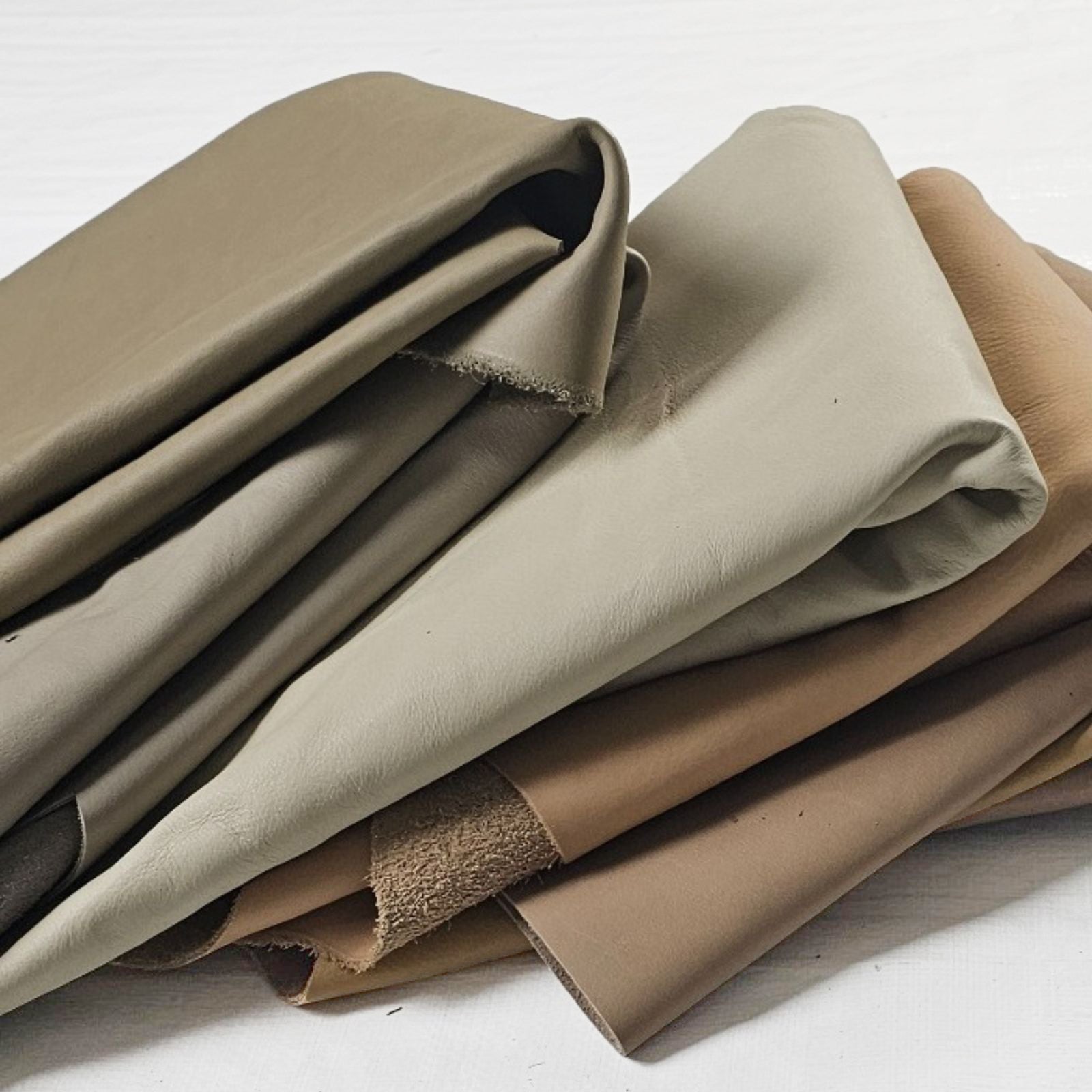 Large leather pieces folded stack in neutral tones