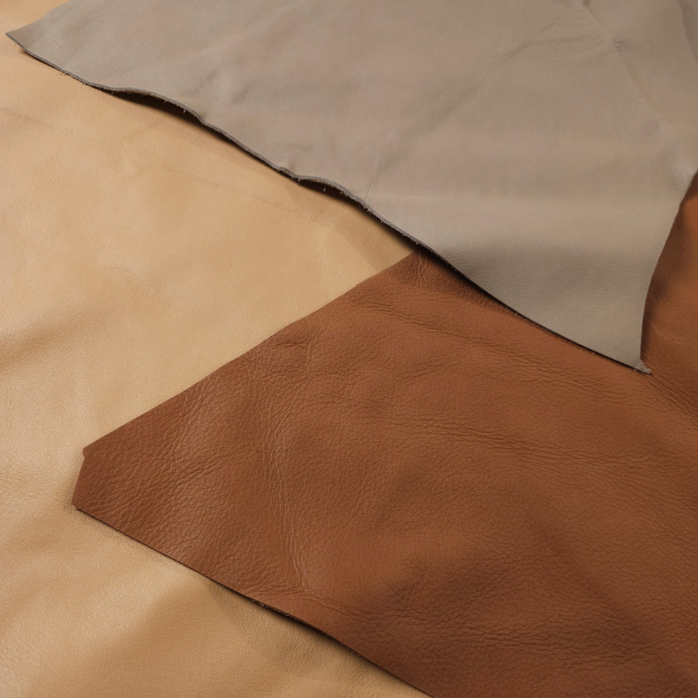 leather scraps texture close up showing grain and finish variety