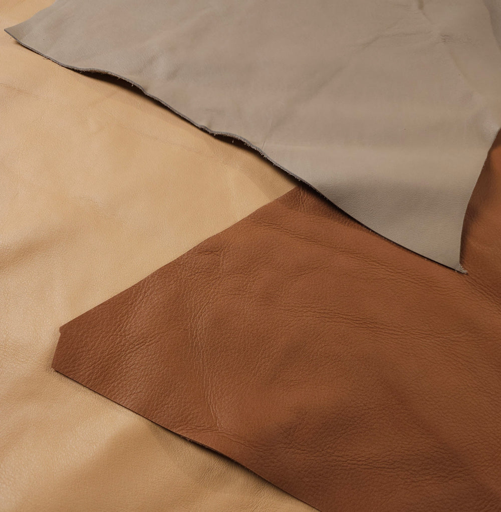 leather scraps texture close up showing grain and finish variety