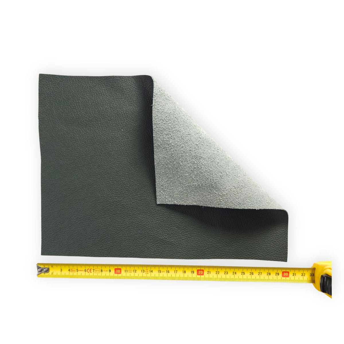 Flexible dark grey leather panel showing the reverse side