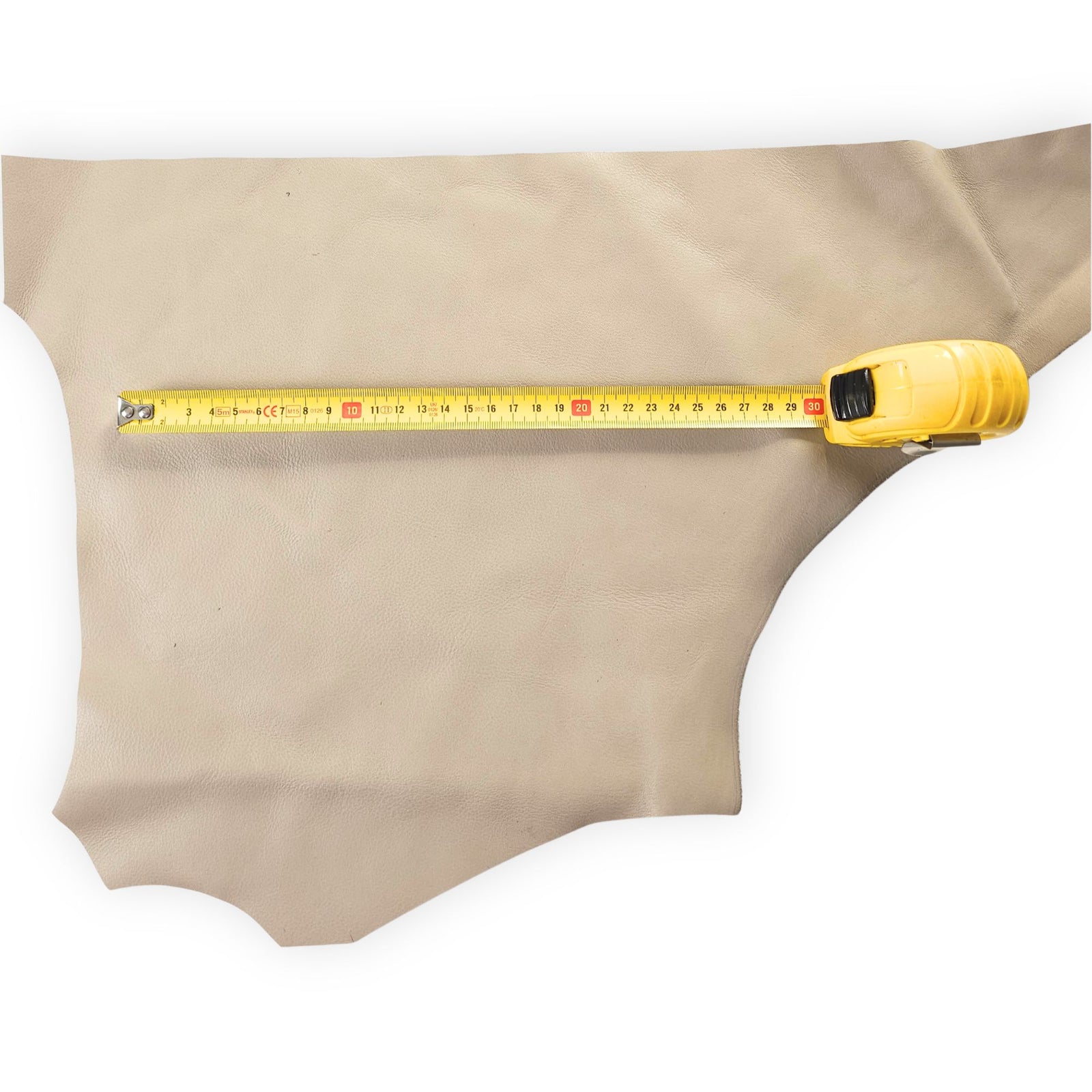 Pale beige cowhide leather scrap shown with measuring tape