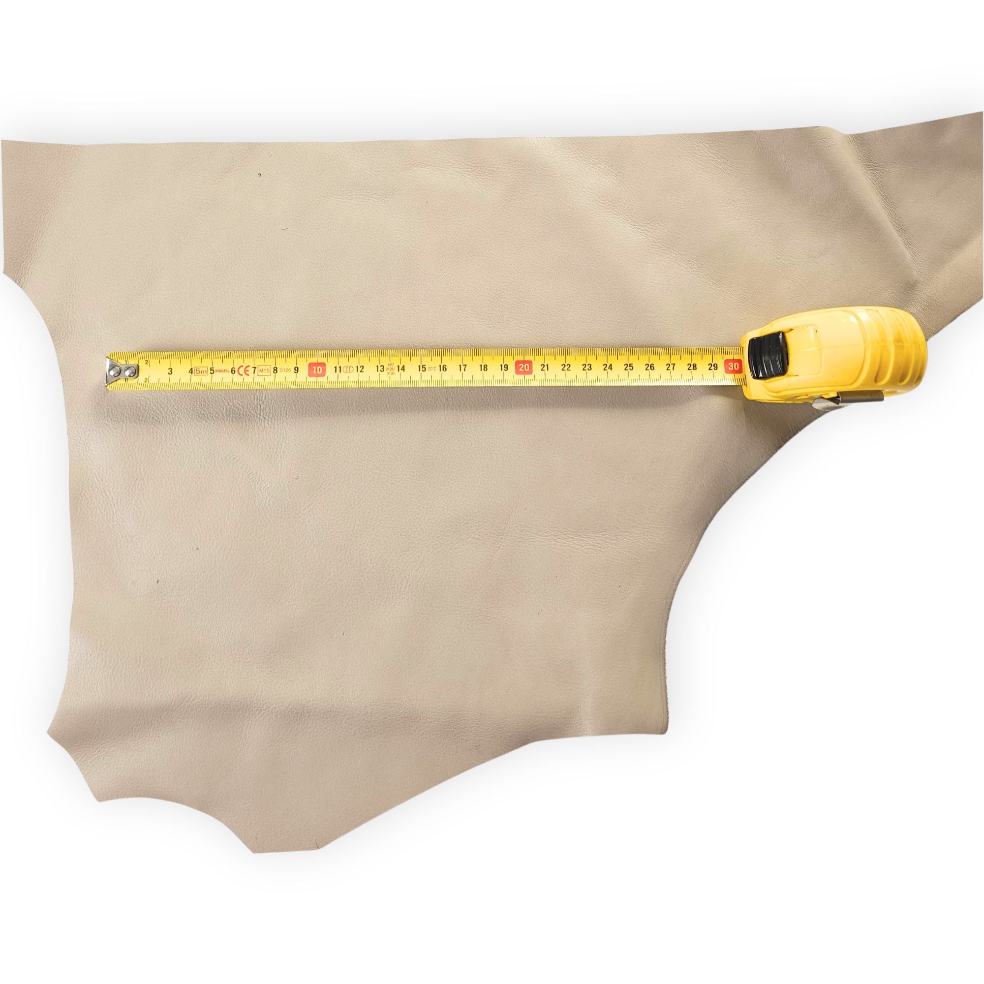Pale beige leather offcut shown with measuring tape