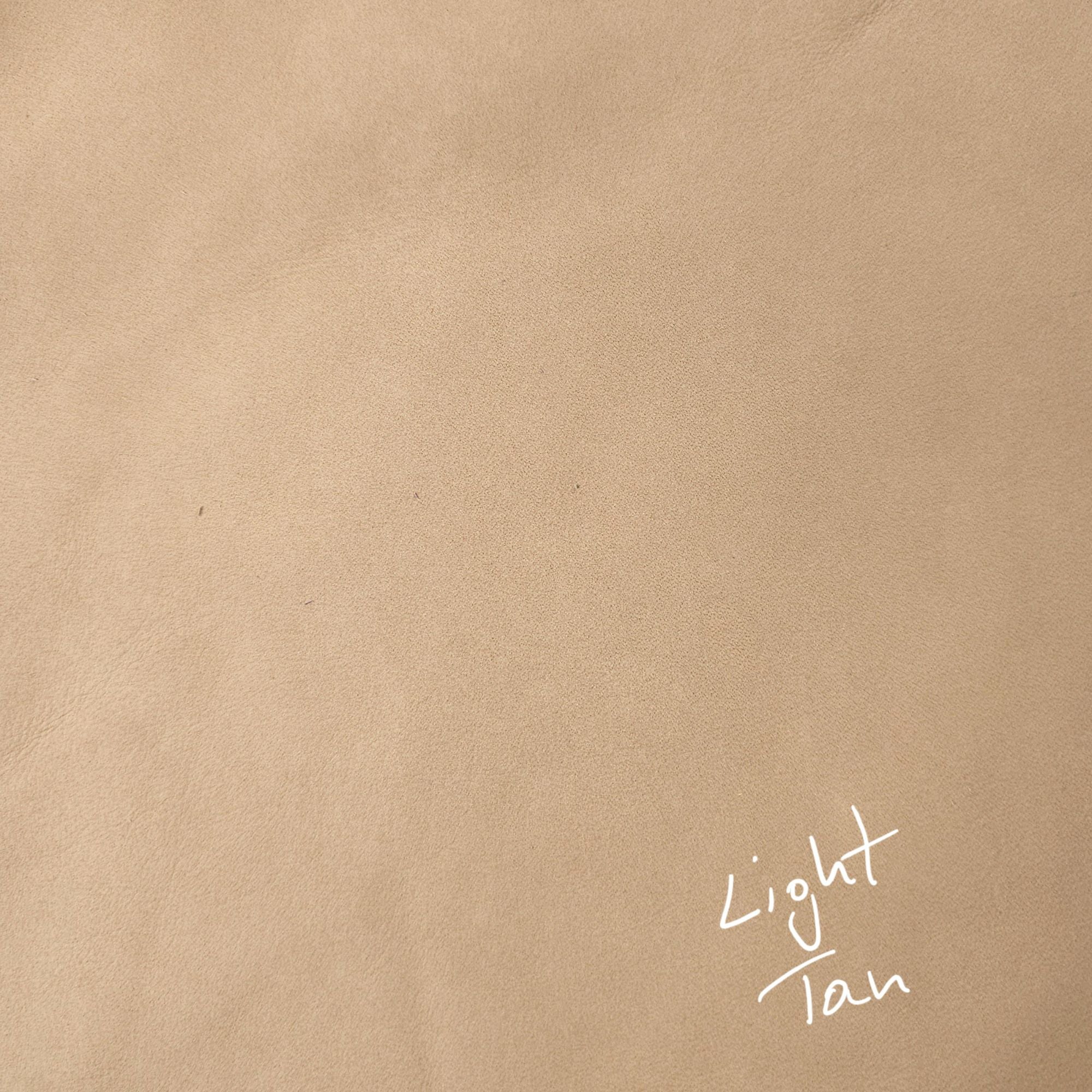 Light tan cowhide leather piece in a warm neutral shade