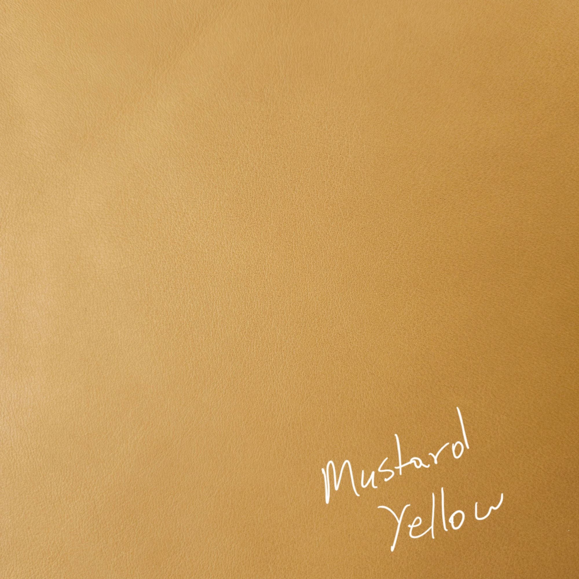 Mustard yellow cowhide leather piece showing smooth grain