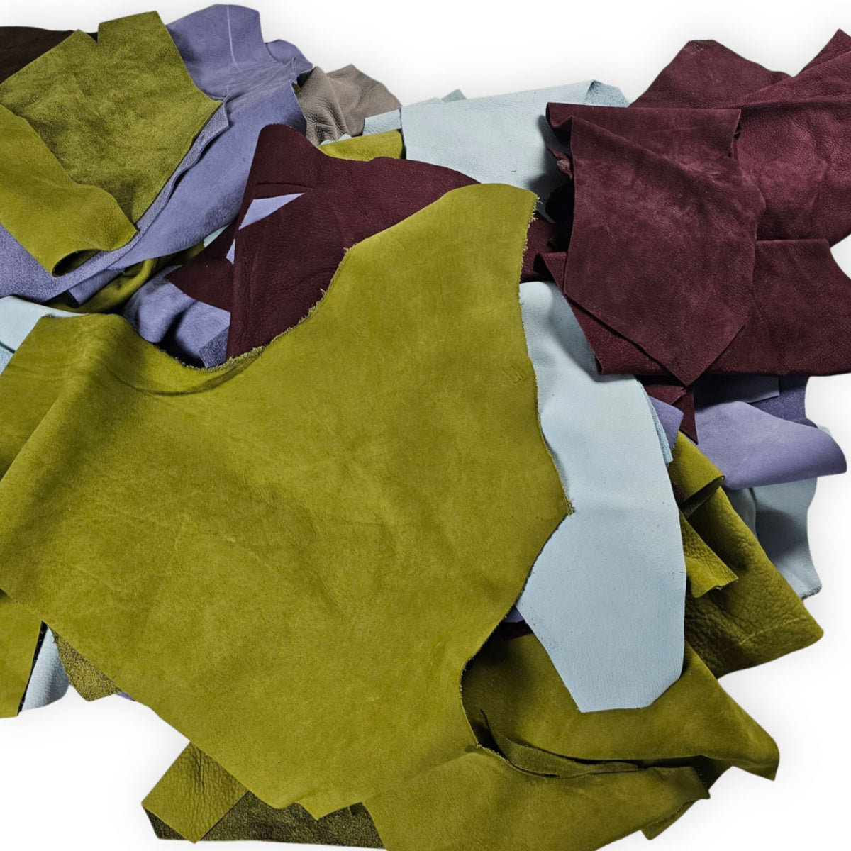 Assorted genuine cowhide nubuck leather offcuts with a soft, velvety surface