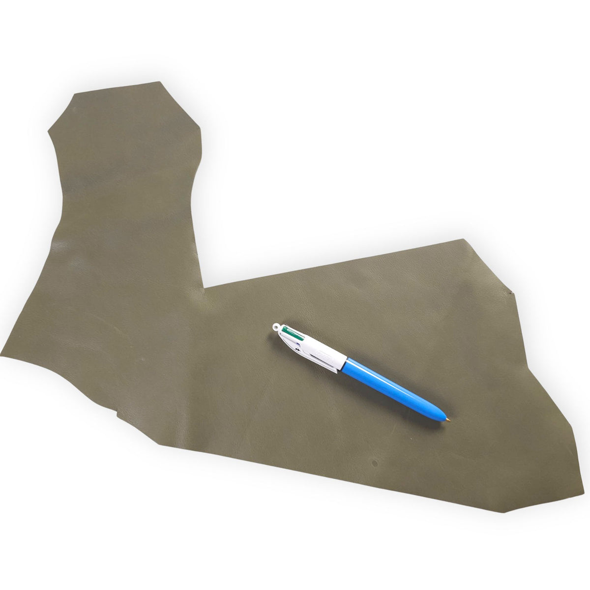 Irregular olive green leather offcut with pen showing approximate size