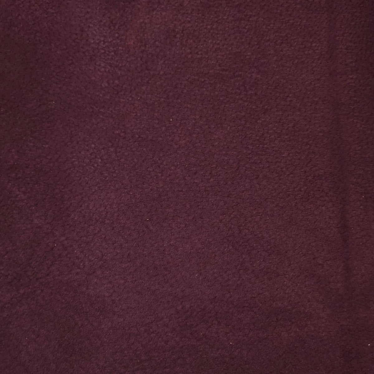 Burgundy pigskin lining leather showing suede texture