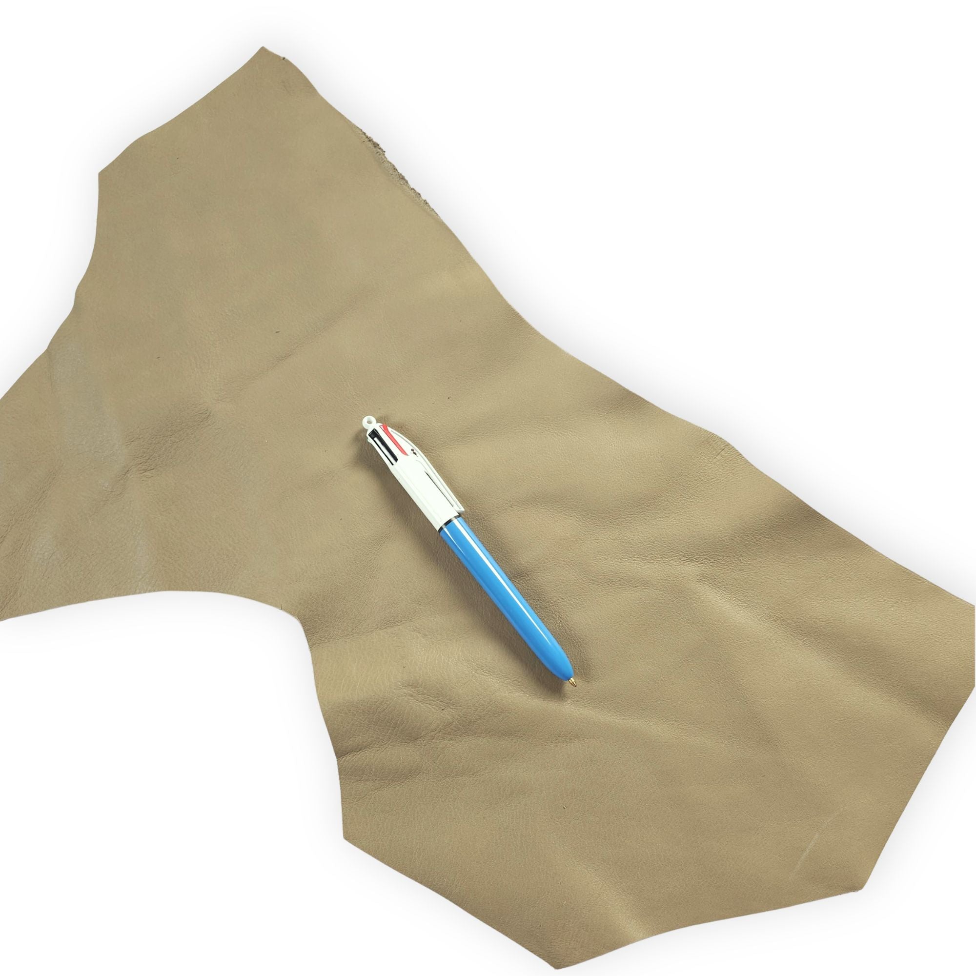 Sage green leather scrap with pen for size reference