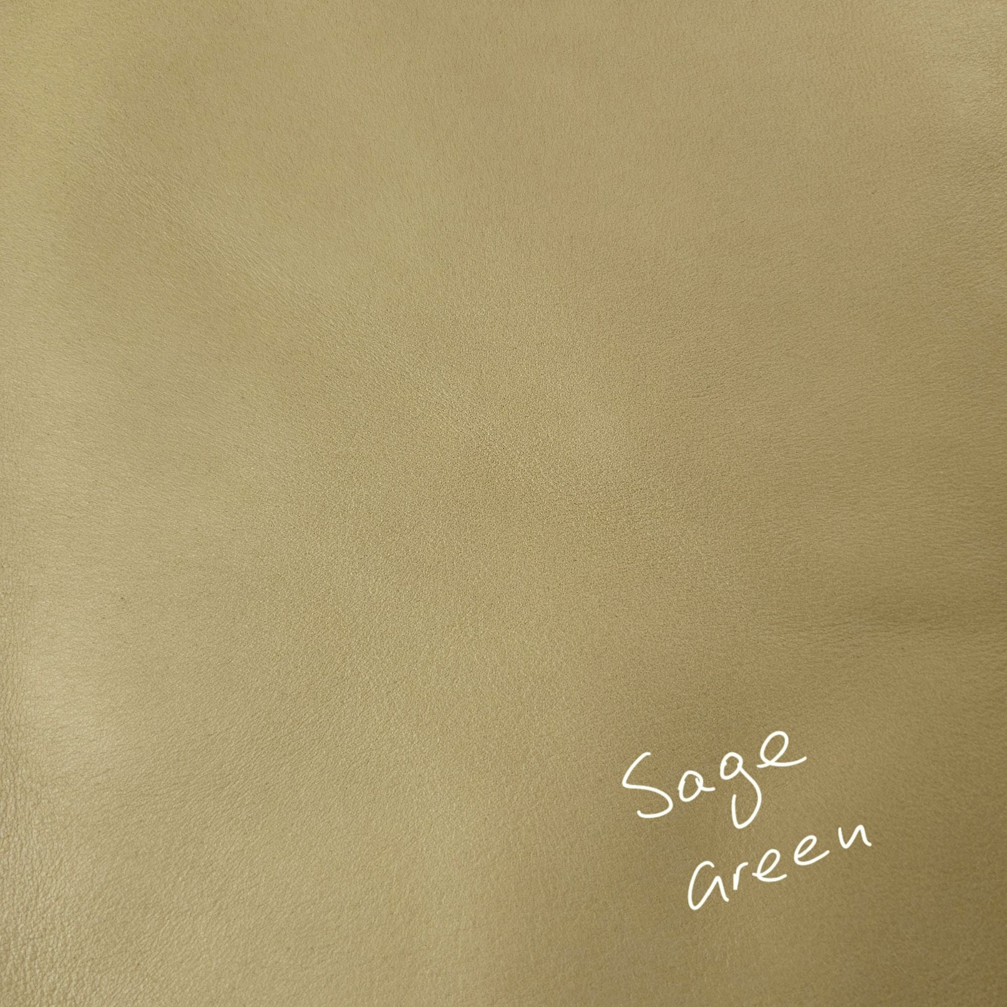 Sage green cowhide leather piece showing natural texture