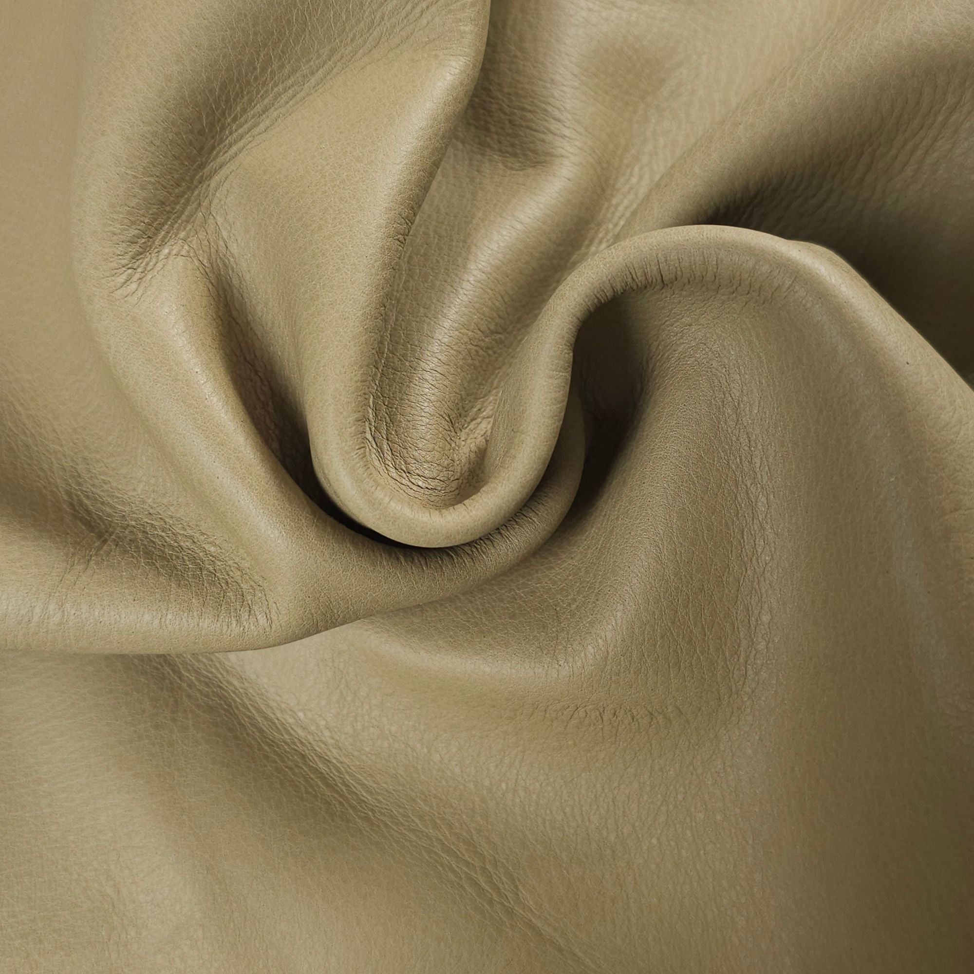 Light sage upholstery leather showing its soft drape and smooth grain