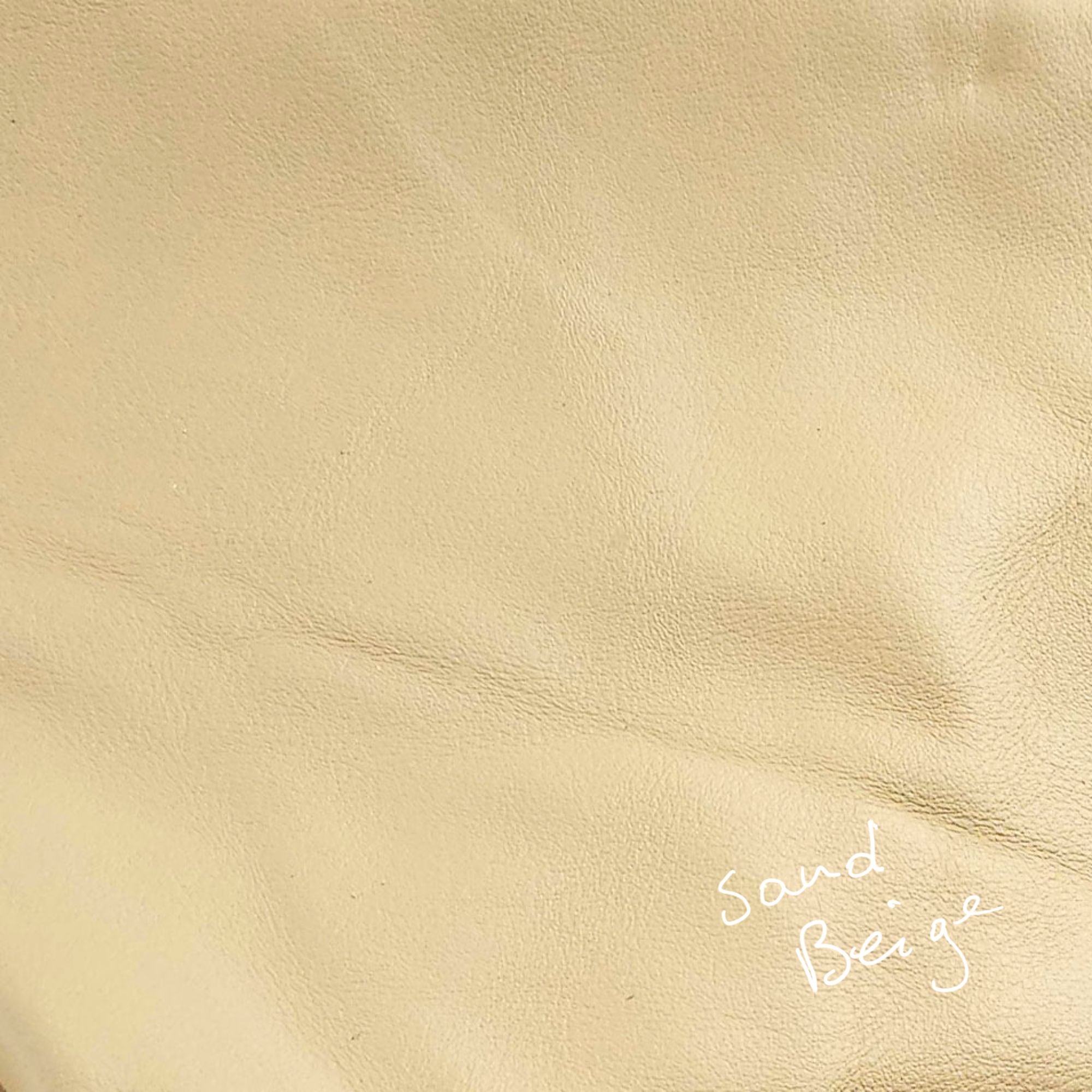Sandy beige cowhide leather piece in a light neutral colour