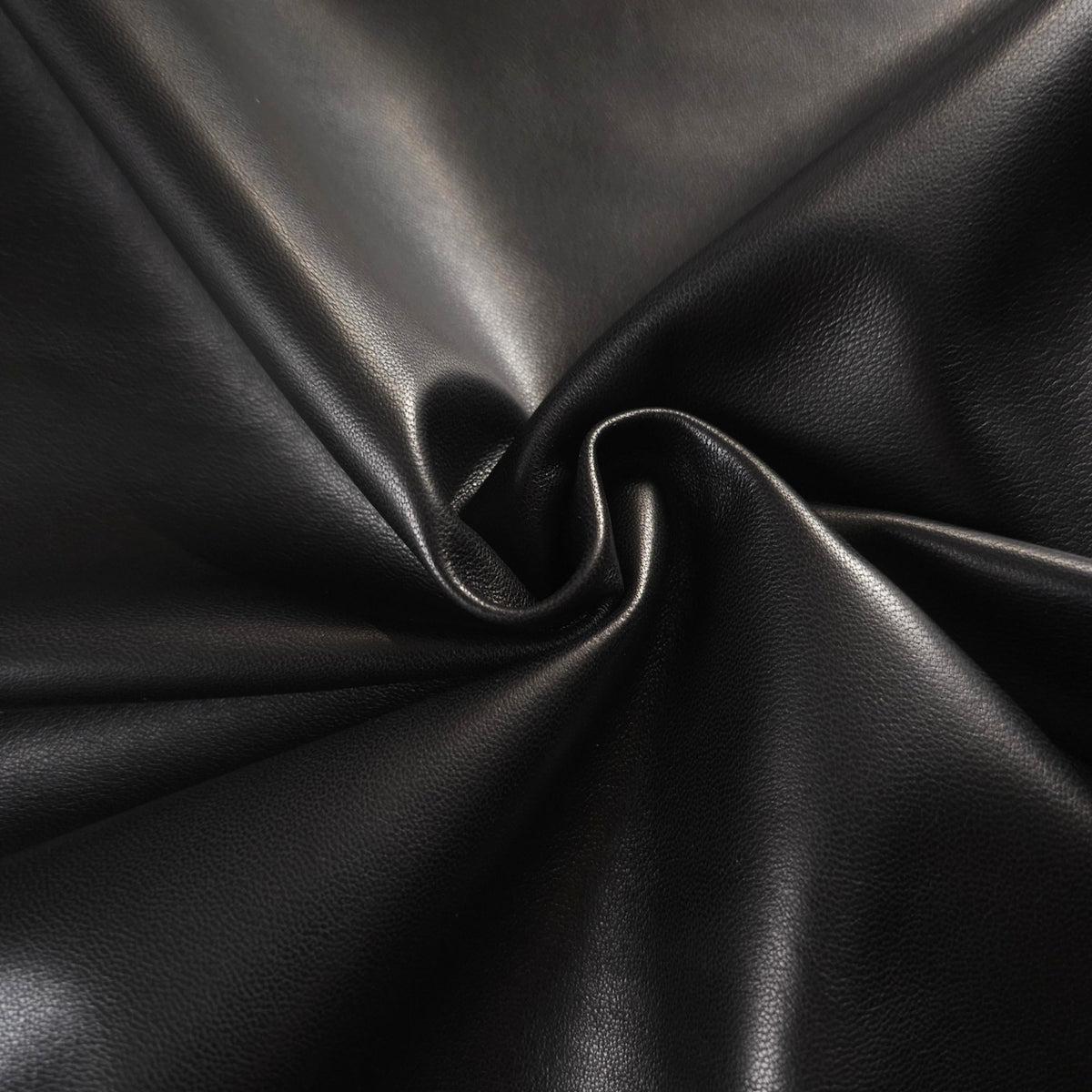 Black sheepskin nappa leather showing soft drape and smooth texture