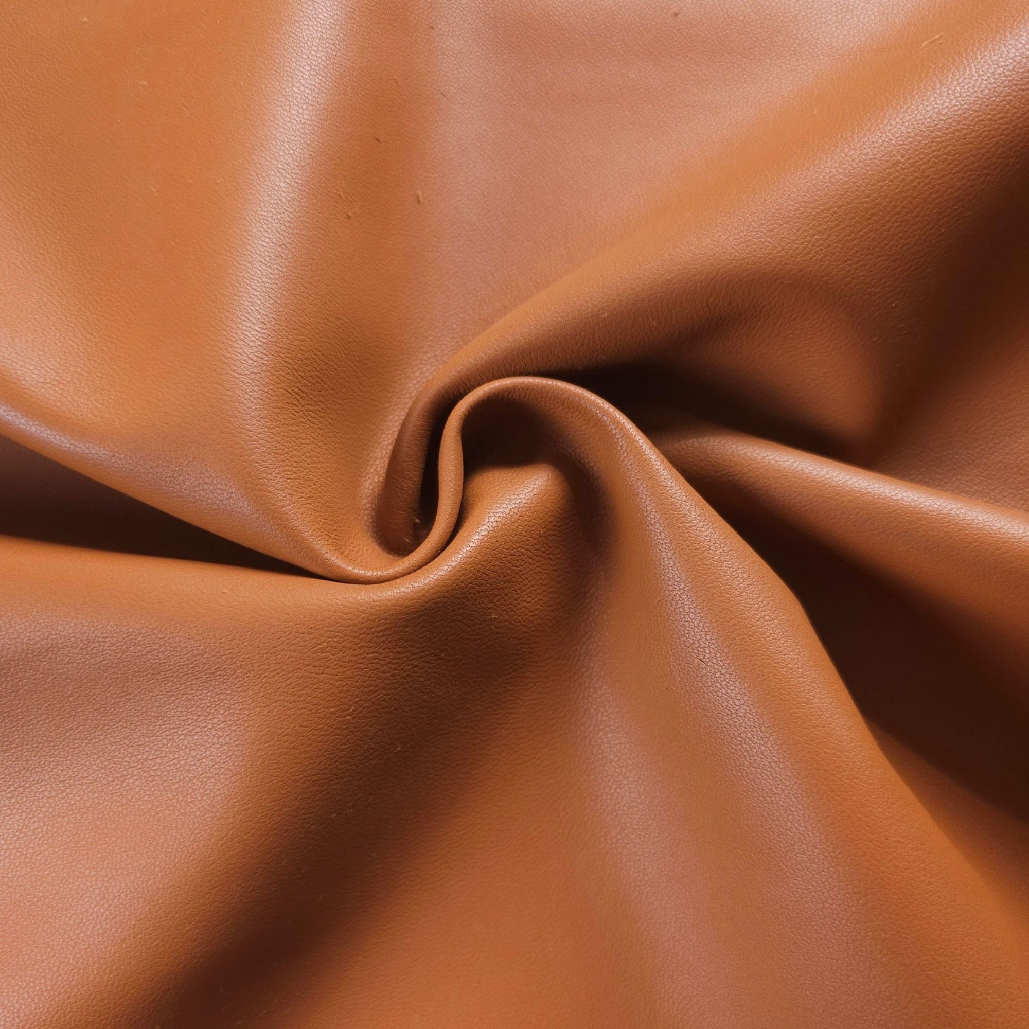 Tan sheepskin nappa leather showing soft drape and smooth texture