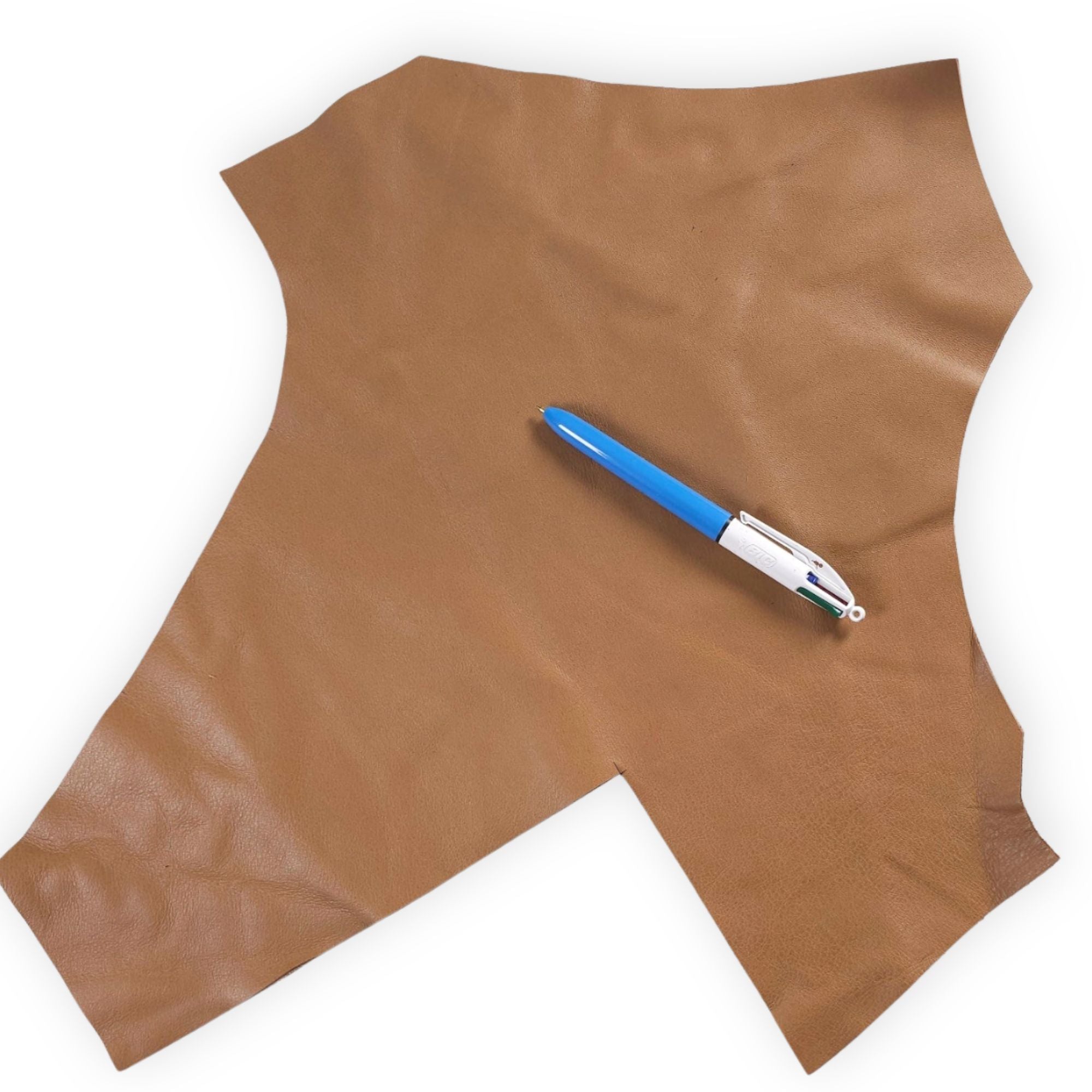 Tan brown leather offcut shown with pen for size reference
