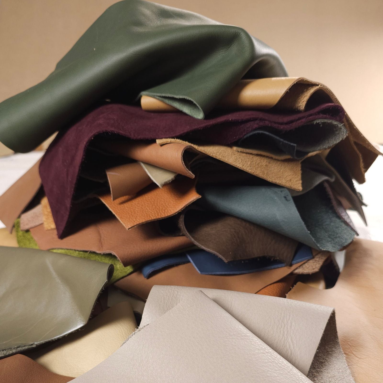 Stacked mixed leather scraps for crafts and small projects