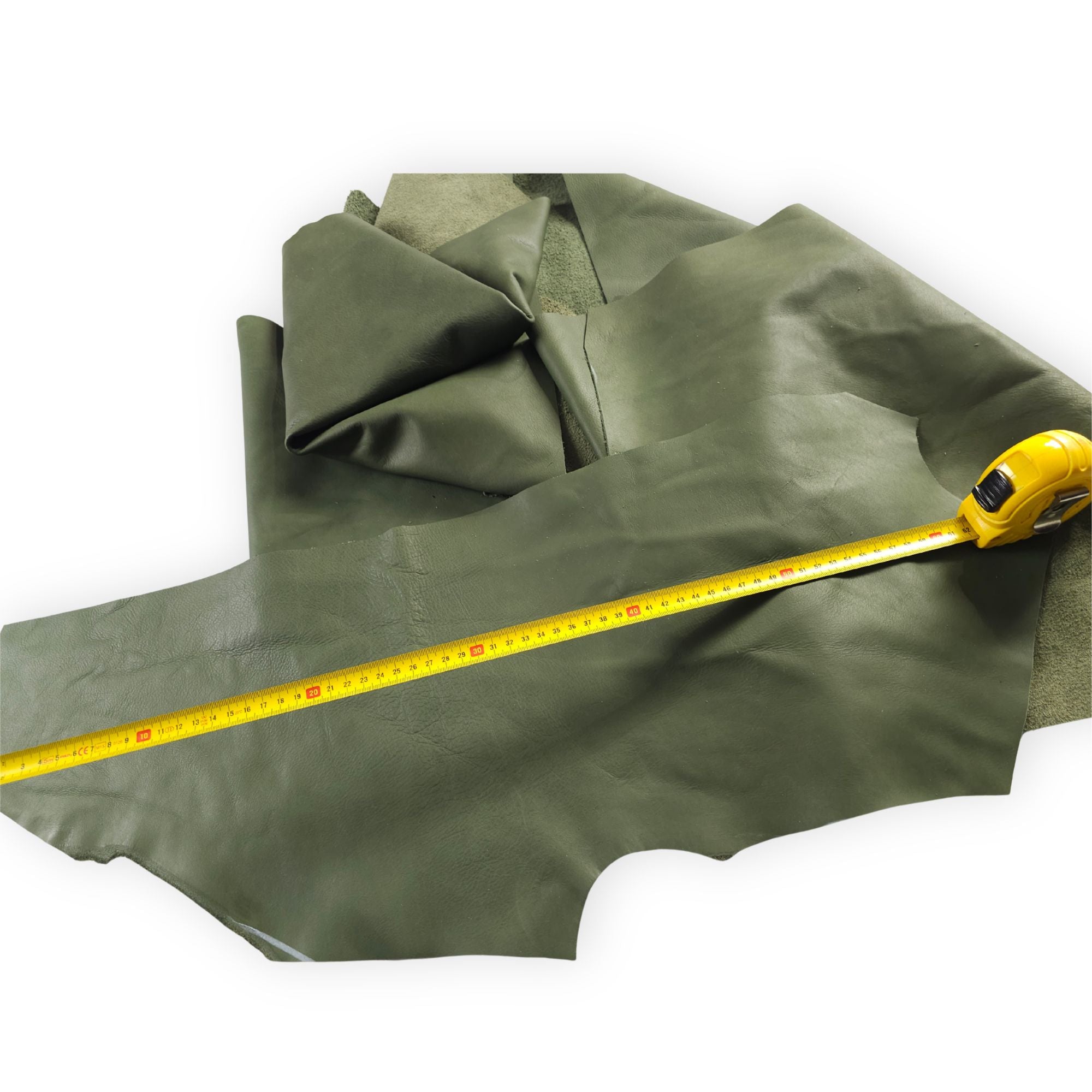 Hunter green cowhide leather piece with a tape measure for size reference