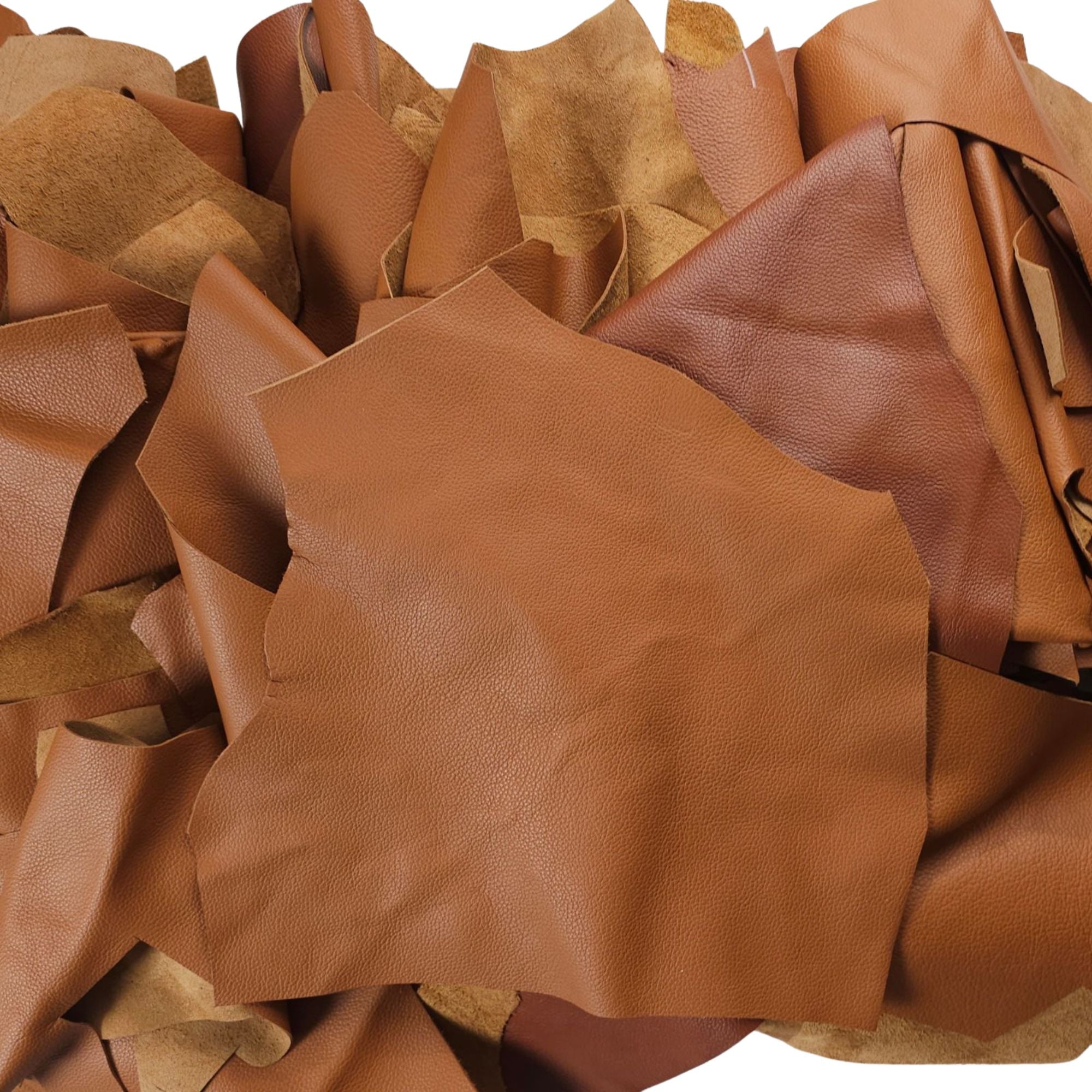 Tan leather scraps in assorted 1–3 hand-sized pieces