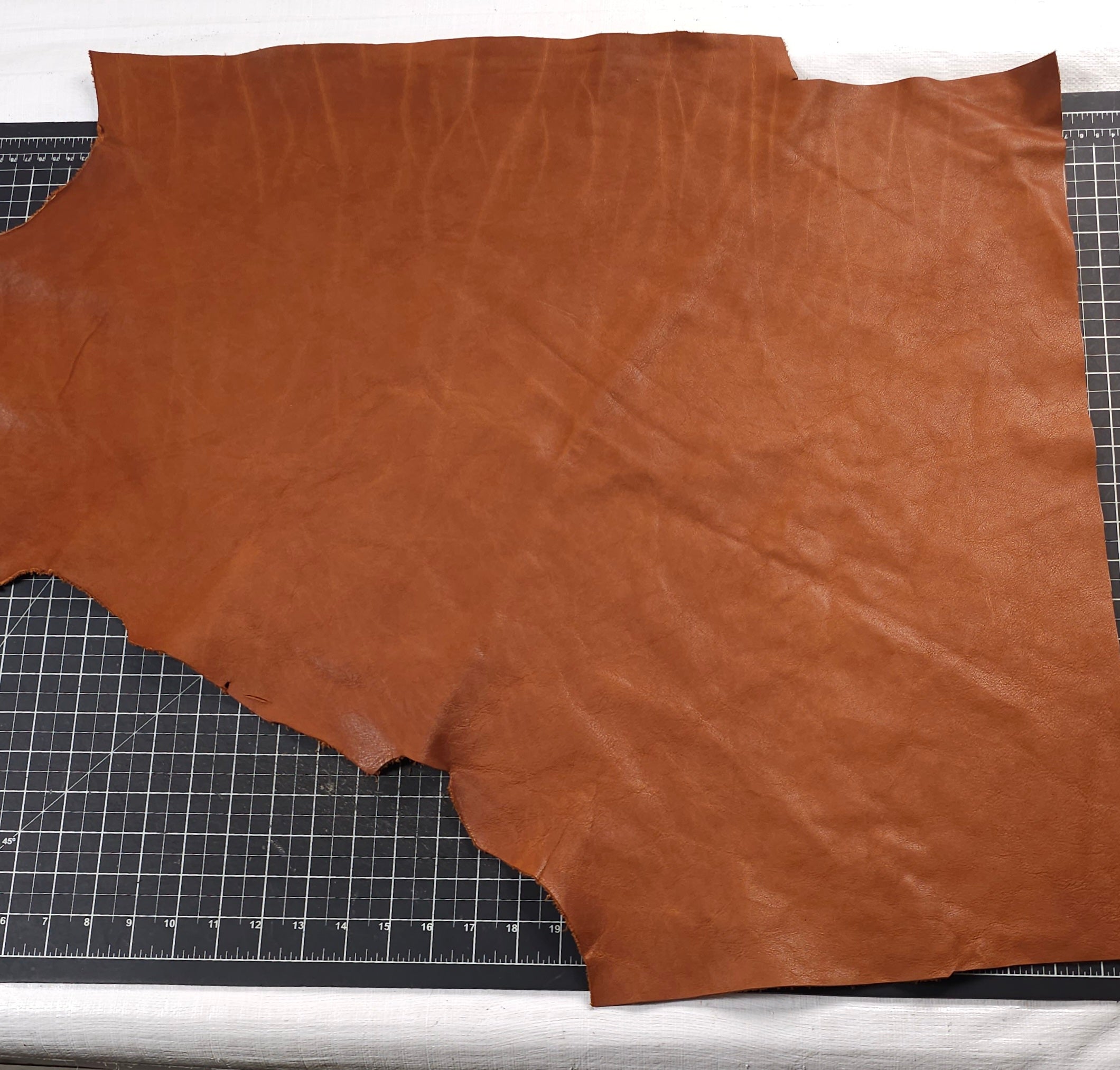Tan veg tan leather piece measured 1 to 2 sq ft