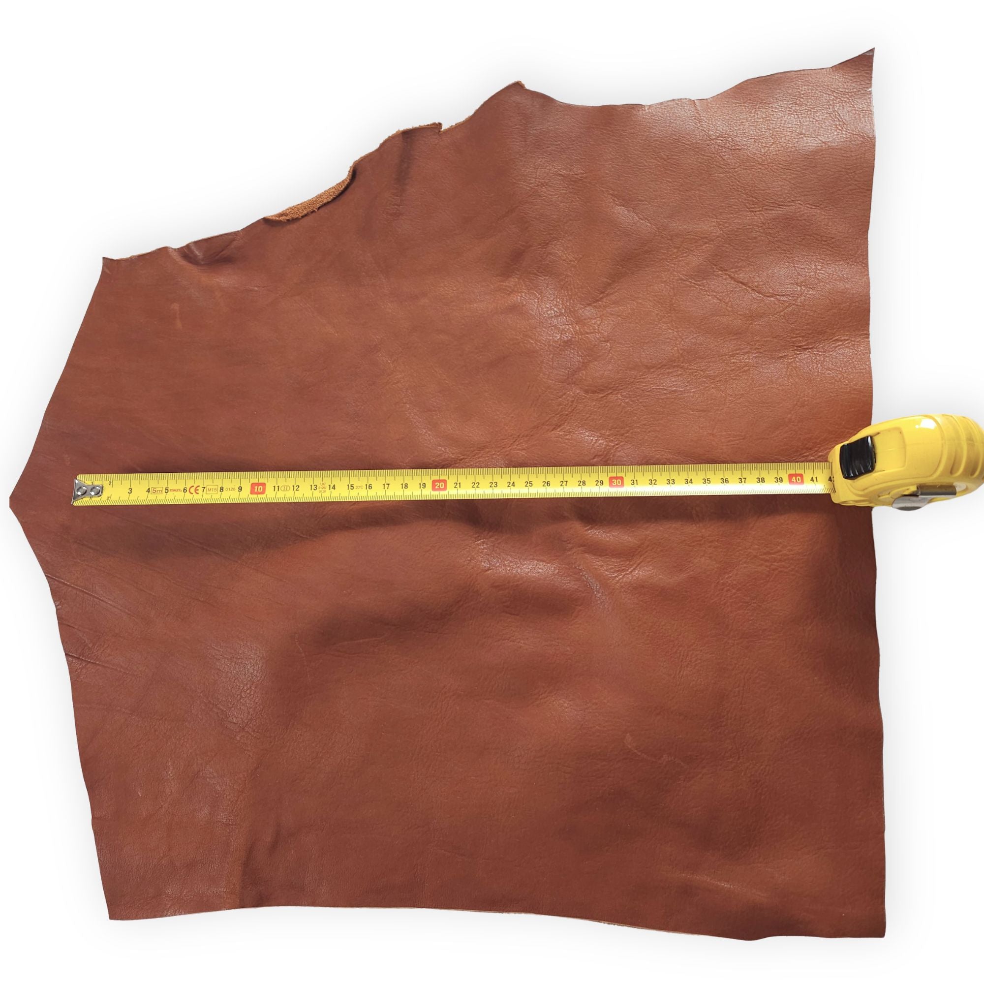 Tan vegetable-tanned cowhide pieces in 1–3 hand sizes