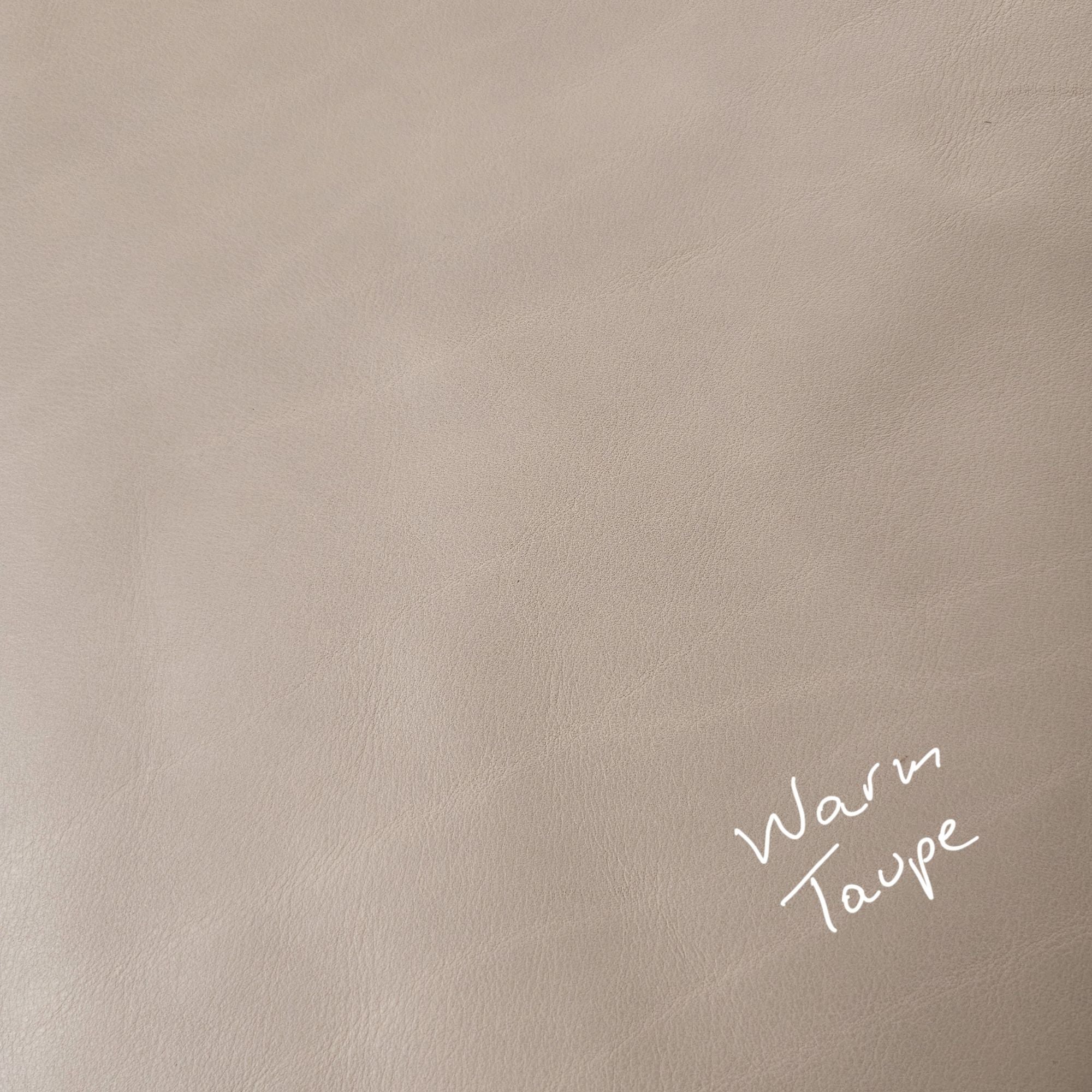 Warm taupe cowhide leather piece showing smooth natural grain