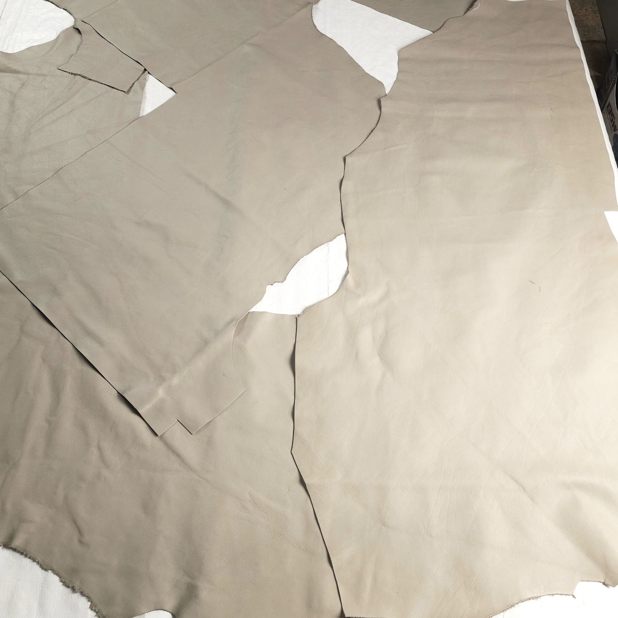 Large warm taupe upholstery leather pieces supplied in a 20 sq ft bundle