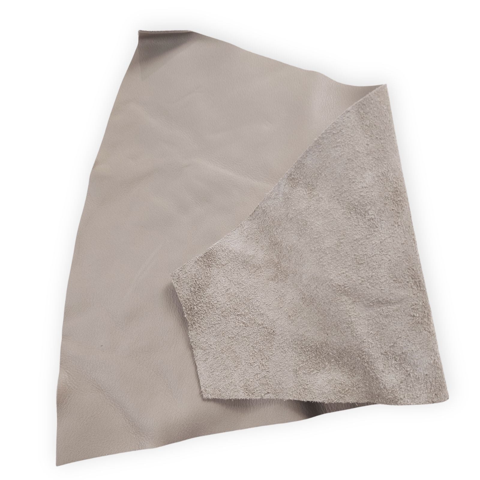 Close-up of warm taupe full-grain upholstery leather showing natural grain and reverse side