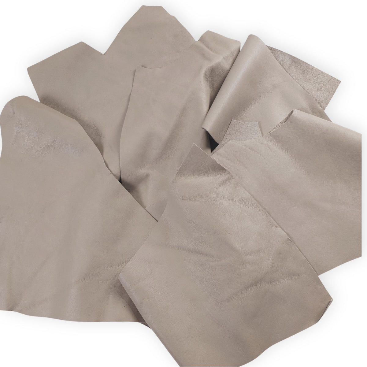 Warm taupe leather scraps in assorted 1–3 hand-sized pieces